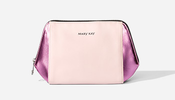 A pink and pink iridescent Mary Kay makeup bag is displayed.