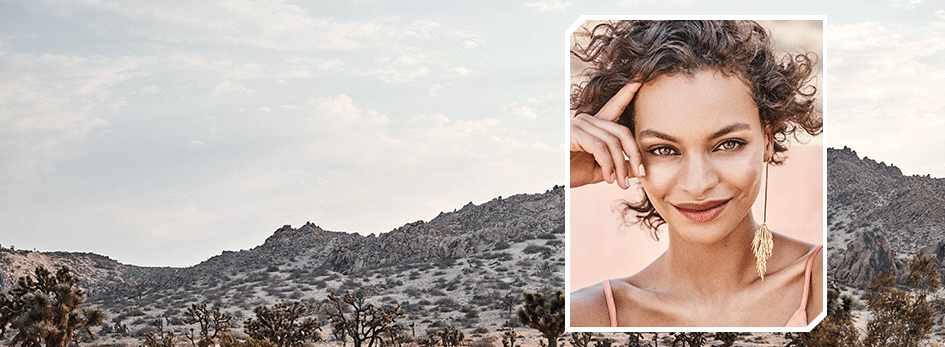 GIF of models posing confidently wearing Mary Kay Lip Tints and Illuminating Drops within a notched-corner box in front of a desert landscape background.
