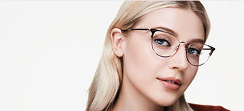 Model wearing glasses representing Mary Kay eye area product testing.