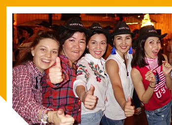 Image of Bibi and four other women giving thumbs up