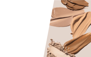 Product rubs of various shades of cream and powder foundations on tan background