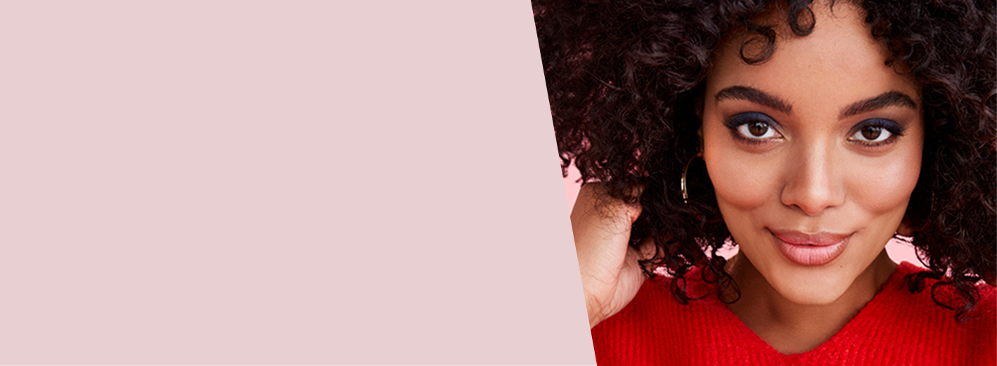 Close up of model wearing Starry Eyes look from Mary Kay against pink background