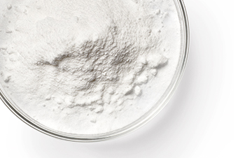 A glass dish with white powder in it