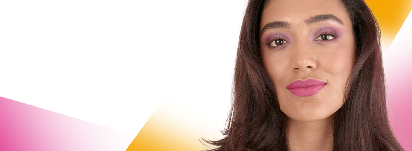 Close up of model wearing Dare To Dazzle makeup artist look surrounded by pink and yellow geometric shapes