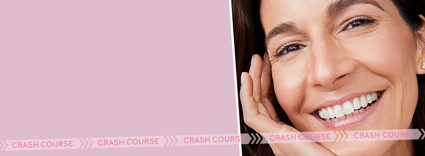 A smiling mature Latina gently caressing her face