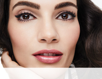 Close-up of model wearing the Day To Night makeup artist look from Mary Kay against a white background.
