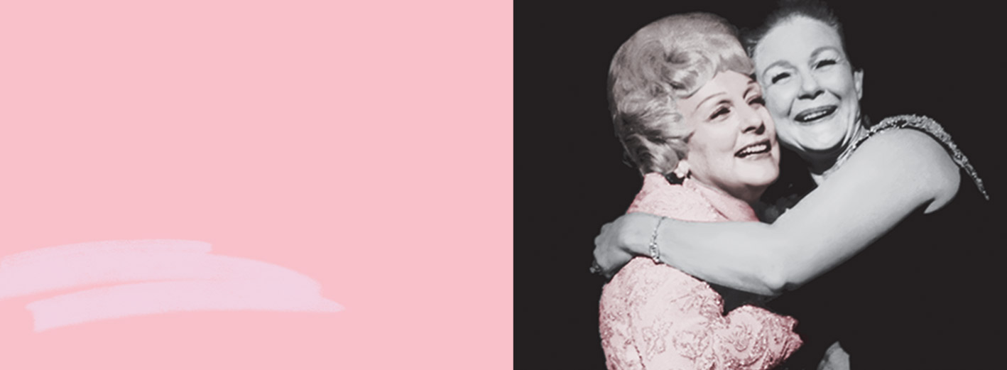 Mary Kay Ash embraces a member of the Mary Kay Independent Sales Force in a warm hug as both women smile.