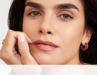 Laid Back Beauty chooser with a dark haired woman with hand under chin