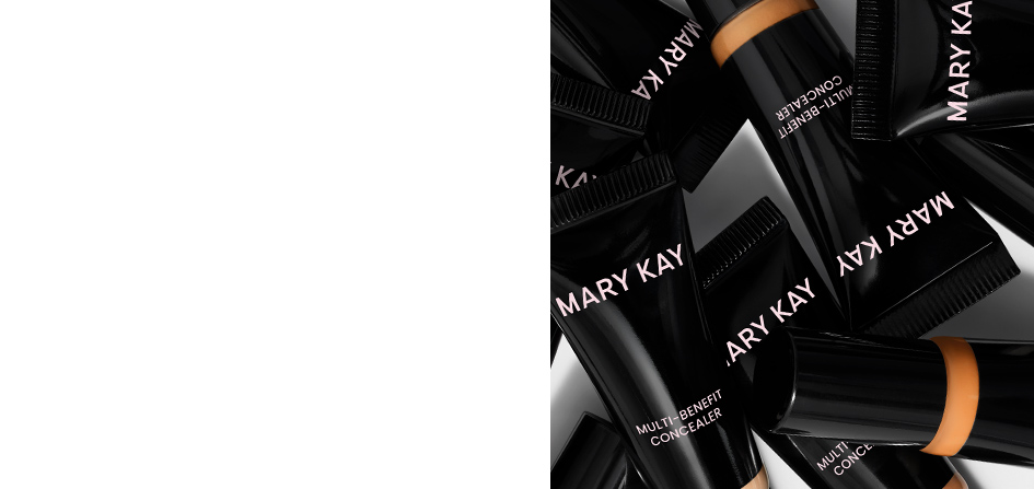 Several closed bottles of concealer in various shades appear on a white background