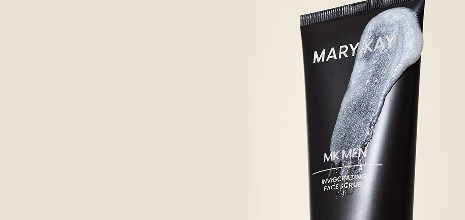 Limited-edition MKMen® Invigorating Face Scrub tube with a swipe of product across.