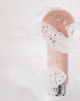 Skinvigorate Duo Facial Device surrounded by bubbles